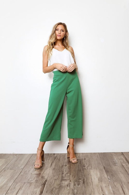 High waisted pants with cropped hem, wide legs, and relaxed fit.